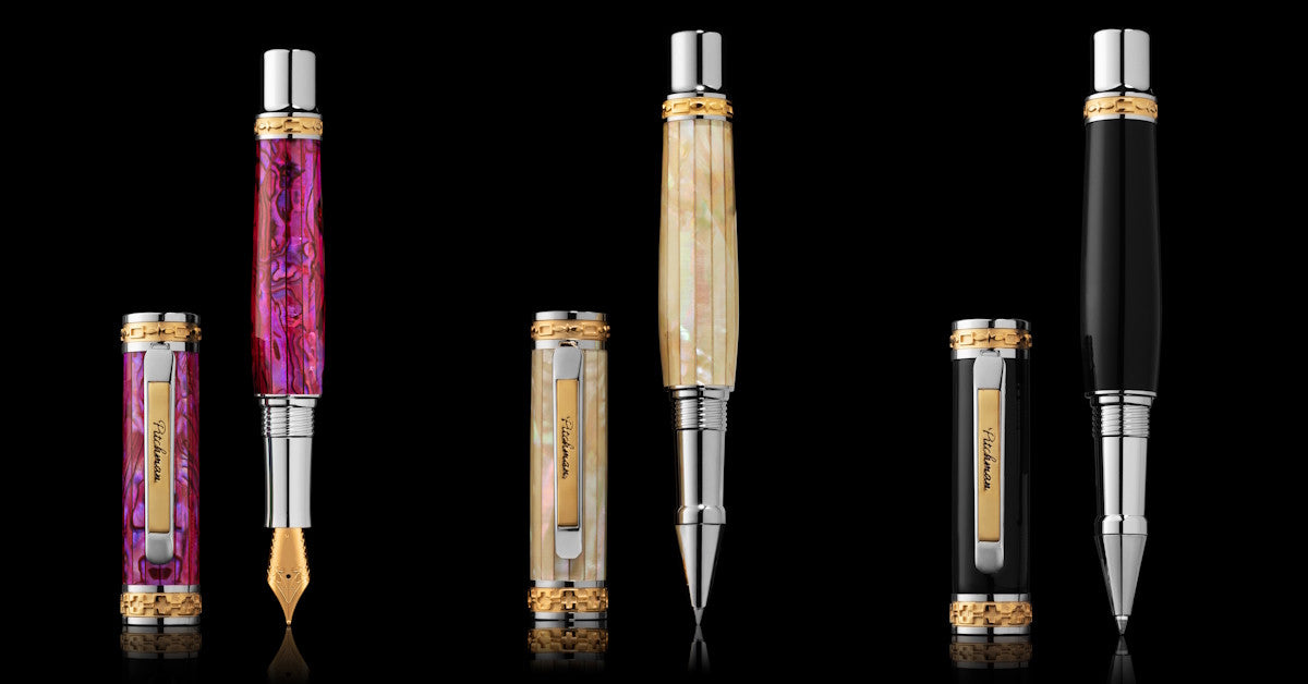 Pitchman fountain and rollerball pens in colorful shell, mother-of-pearl and black finishes against a black background
